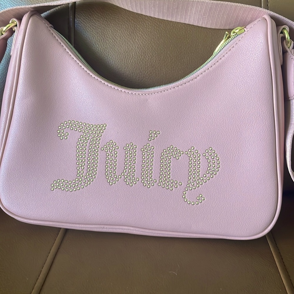 Juicy Coture crossbody bag used once but has a little flaw on back of bag